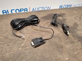 a close up of a charger and a cord on a table
