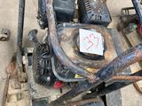 an image of a lawn mower sitting on the ground