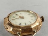 an image of a close up of a watch on a table