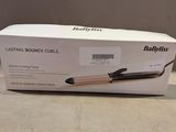 packaging of a babylis hair dryer sitting on a table