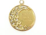 an image of a gold plated pendant with a quote on it