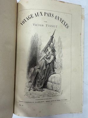 un vieux livre sur lequel figure le dessin d'une femme tenant un drapeau