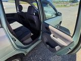 a car that has its door open on the side of the road