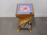 an image of a small table with a colorful design on it