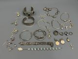 several different types of bracelets and rings on a table