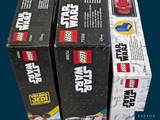 three boxes of lego star wars are stacked on top of each other