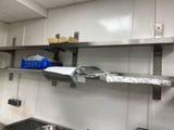 a metal shelf that has some items on it