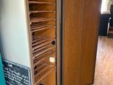 a large open cabinet in the middle of a room
