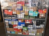 a metal cart with many boxes on it in a warehouse