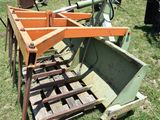 a tractor that is sitting on a pallet in the grass