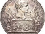une image représentant une médaille d'argent ornée du buste d'un homme