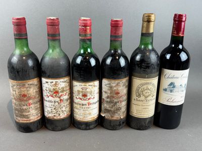 several bottles of wine are lined up on a table