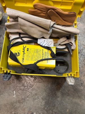 a yellow tool box with gloves, gloves and a pair of scissors