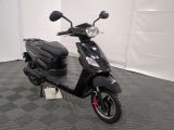 a scooter that is parked in a room