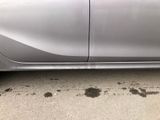 a picture of a silver car parked on the side of the road