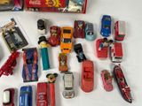 a lot of toy cars that are sitting on a table