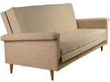 beige upholstered sofa with wooden legs and arm rests against a white background