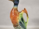 a colorful bird that is sitting on a table
