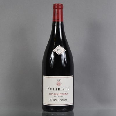 a bottle of red wine sitting on top of a table