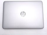 a laptop that is sitting on a white table