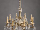 a brass and crystal chandelier with five lights