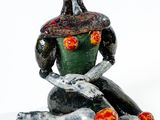 statue représentant une femme assise sur un rocher, un serpent sur les genoux