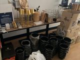 a table with a lot of cups and other items on it