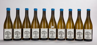 six bottles of wine lined up in a row on a table