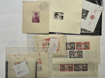 many different types of stamps and envelopes on the table