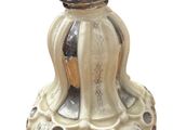 a white vase with a silver top on a white background