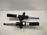a pair of shock absorbs for the front and rear of a car