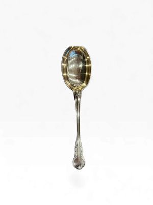 a spoon with a spoon handle on it on a white surface