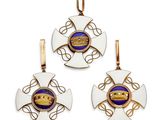 a set of three gold and enamel pendants with a crown
