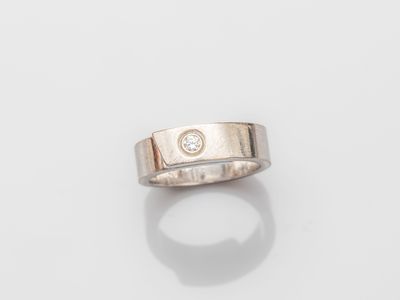 a gold ring with a diamond set in the center