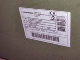 a label on the back of a green suitcase