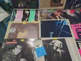 a lot of records on a table with a lot of stickers on it