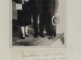 a black and white photo of three men in suits and hats