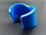 a close up of a blue plastic object on a table