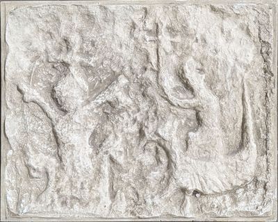 a relief of a group of people on a wall