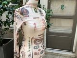 an image of a mannequin with a scarf on it in front of a door