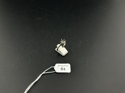 an image of a piece of metal with a tag attached to it