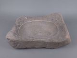 a stone bowl that is sitting on a table