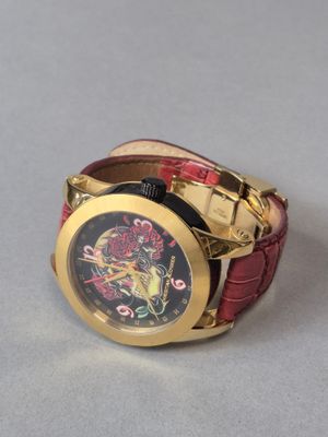 CHRISTIAN AUDIGIER Montre d'homme en métal doré à décor de t…