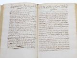 an old book with writing on it sitting on a table