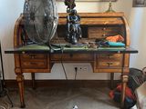 a desk with a fan and a fan on top of it