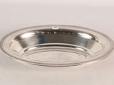 an image of a silver plate with a beaded edge