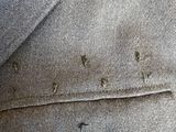 a close up of a button on a suit jacket
