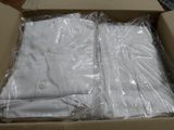 a box with a bunch of white shirts inside of it