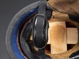 a brown bag with a pair of headphones in it