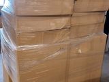 a large stack of boxes sitting on a pallet in a warehouse